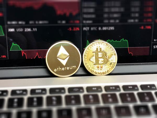 Gold ethereum coin and bitcoin gold coin.