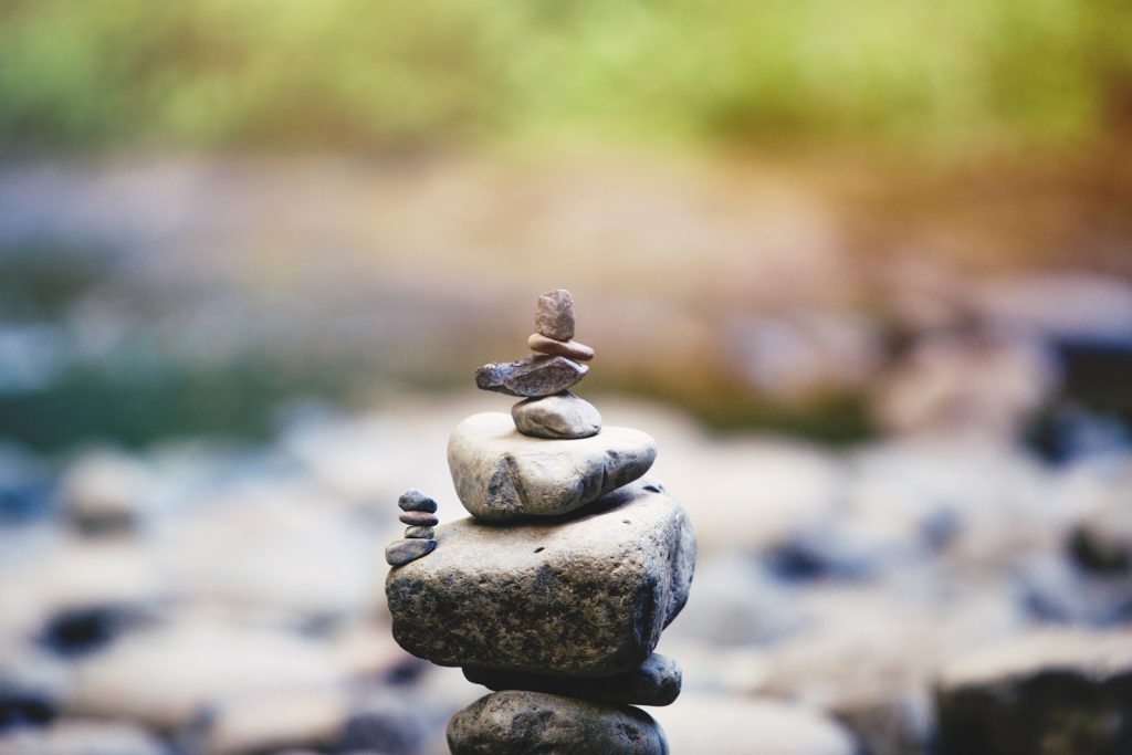 Stack of rocks precariously balanced.