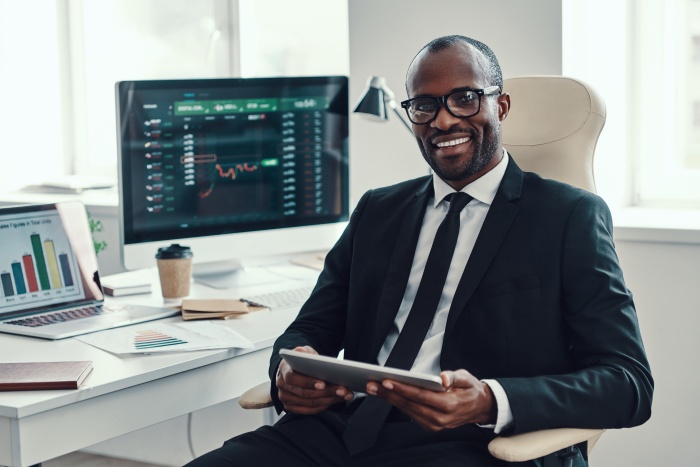 trader sitting at a desk