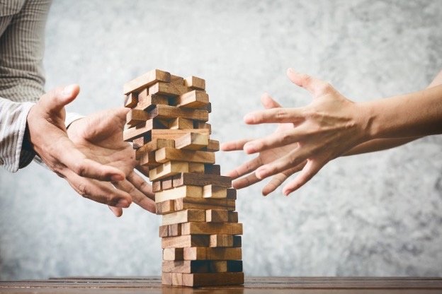 wooden puzzle toppling