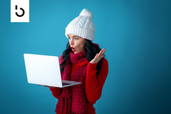 happy woman viewing a laptop screen